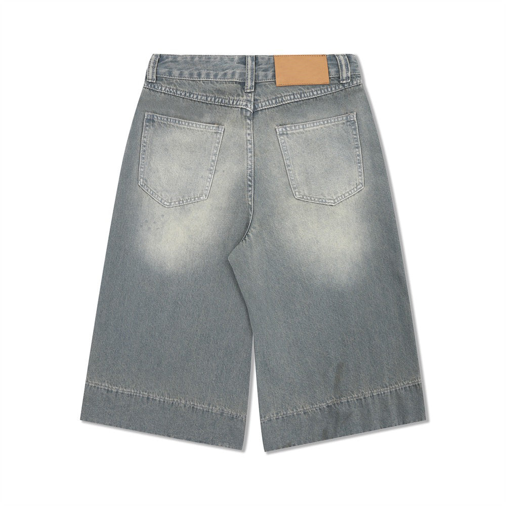 SATC PROJECT  cropped pants denim shorts with a whiskered wash and basic white creasing.